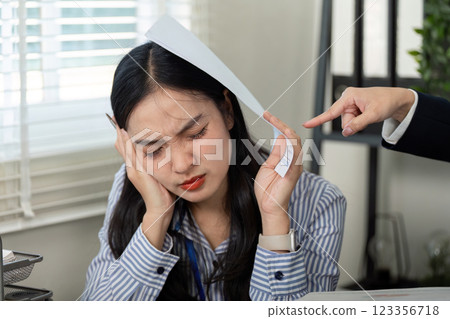 Stressed professional woman overwhelmed by work, dealing with financial challenges. Stressed professional woman overwhelmed by work, dealing with financial challenges. 123356718