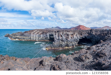 Majestic Volcanic Coastline with Rugged Cliffs and Ocean 123356936