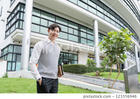 Stylish Professional Ready for Business Endeavors Outside Corporate Building 123356946