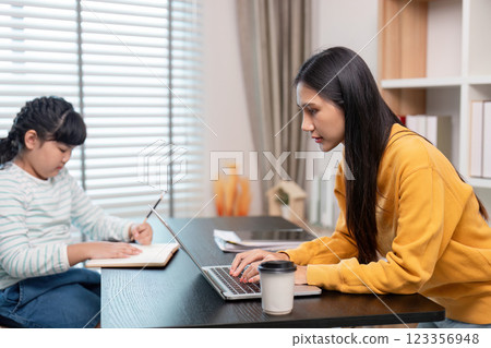 Studious Time Focused Mother and Daughter Engaged in Learning 123356948