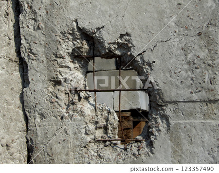 Cannon Shell In Broken Concrete Fence 123357490