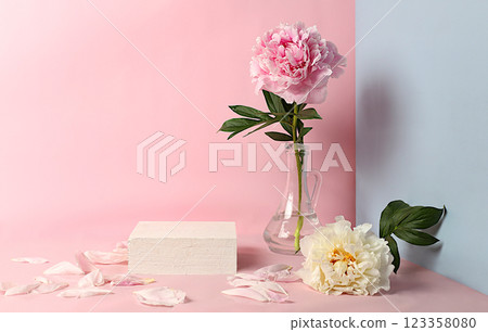 Minimal floral composition.Abstract background with empty podium and peonies flowers,empty showcase for display or presentation of cosmetic products,postcard with place for text,selective focus Minimal floral composition.Abstract background with empty podium and peonies flowers,empty showcase for display or presentation of cosmetic products,postcard with place for text,selective focus 123358080