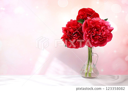 Abstract floral arrangement, beautiful burgundy peonies on an elegant background in a vase, spring and summer banner. Creative modern bouquet. Mother's Day card, happy birthday, wedding, 123358082