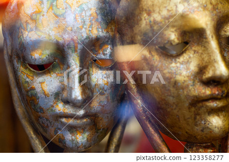 beautiful two realistic Venetian masks in golden color 123358277