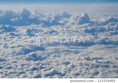 beautiful thick clouds in the sky from the height of the plane 123358469