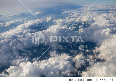 beautiful thick clouds in the sky from the height of the plane 123358471