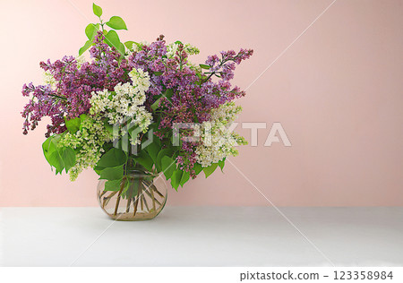 Abstract flower arrangement, home interior with beautiful spring lilac branches in a vase, banner, still life with space for text, floral holiday card, selective focus 123358984