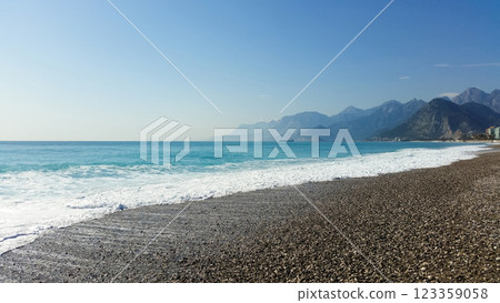 beautiful landscape on the coast of the beach and sea waves against the background of the blue sky 123359058
