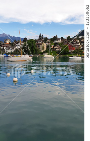 beautiful ships and boats are moored near the shore beautiful ships and boats are moored near the shore 123359062