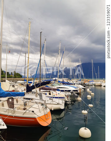 beautiful ships and boats are moored near the shore 123359071