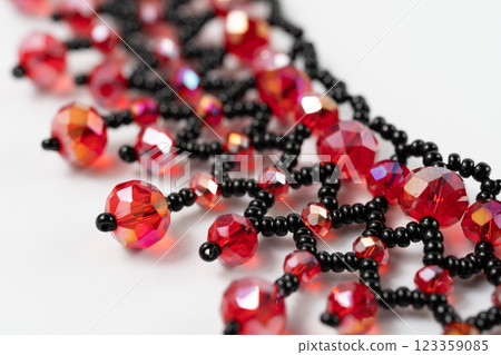 handmade colorful bead necklace close-up isolated on white background. handmade colorful bead necklace close-up isolated on white background. 123359085
