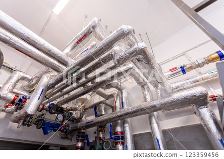 A complex pipe system in a modern facility using various technologies and strategies A complex pipe system in a modern facility using various technologies and strategies 123359456
