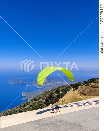 beautiful landscape with a view of the sea flying on a paraglider beautiful landscape with a view of the sea flying on a paraglider 123359536