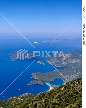 beautiful landscape with a view of the sea flying on a paraglider 123359539