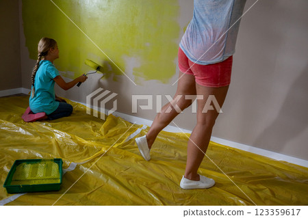 Creative Kids Painting a Room in Bright and Vibrant Colors Together for Fun and Joyful Experiences 123359617