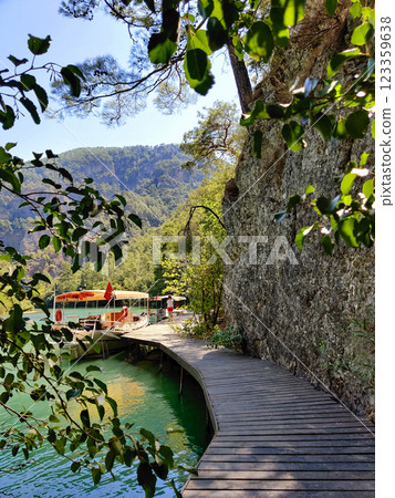 beautiful ships and boats are moored near the shore beautiful ships and boats are moored near the shore 123359638