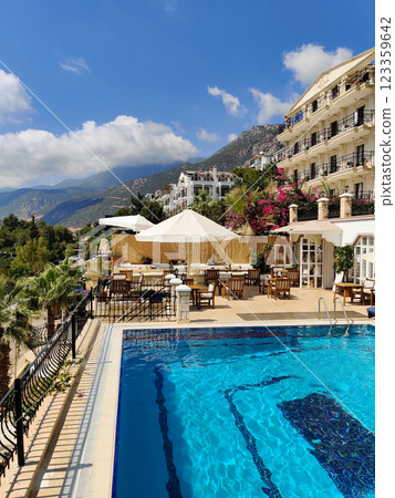 a beautiful large swimming pool near the house a beautiful large swimming pool near the house 123359642