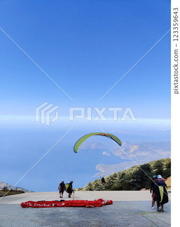beautiful landscape with a view of the sea flying on a paraglider 123359643