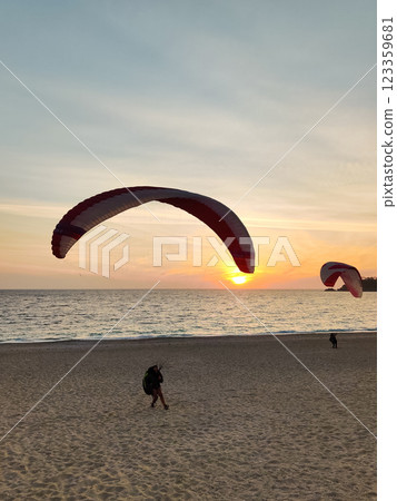 beautiful landscape with a view of the sea flying on a paraglider 123359681