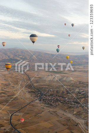 beautiful scenery flight of balloons in the mountains of Cappadocia in love valley beautiful scenery flight of balloons in the mountains of Cappadocia in love valley 123359693