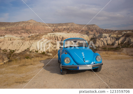 blue retro car in the mountains of cappadocia 123359706