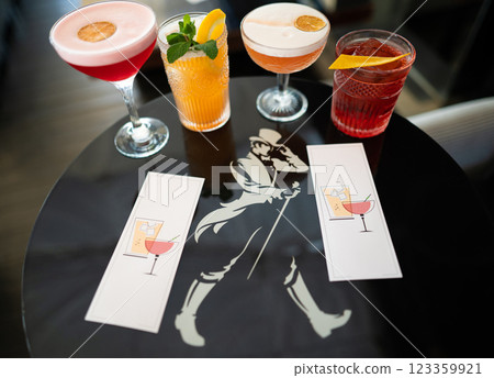 beautiful and delicious alcoholic cocktails prepared at the bar by the bartender. 123359921