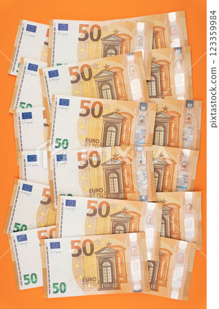 50 euro bills on an orange background 123359984