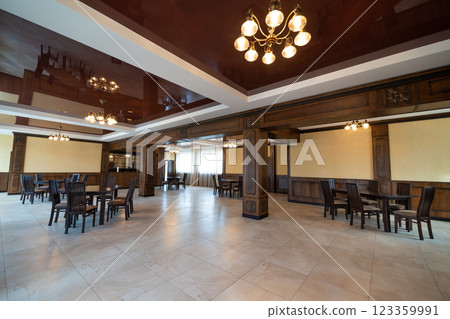 spacious interior of modern empty large restaurant with tables and chairs. spacious interior of modern empty large restaurant with tables and chairs. 123359991