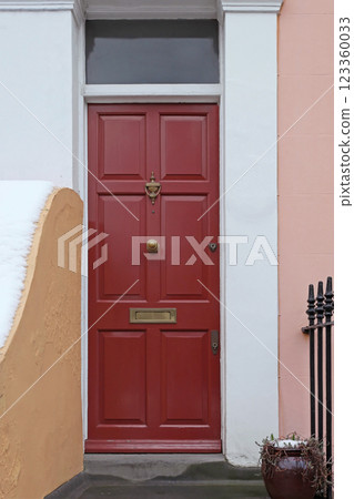 Closed red door 123360033