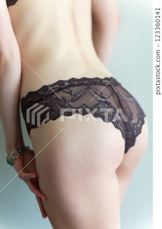 Young woman with a pretty ass in violet lace panties. 123360141