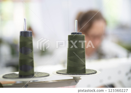 close-up of skeins of thread at an industrial sewing factory for tailoring clothes 123360227