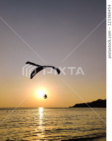 beautiful landscape with a view of the sea flying on a paraglider beautiful landscape with a view of the sea flying on a paraglider 123360454