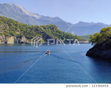 a beautiful ship is sailing in the blue sea 123360458