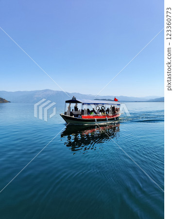 a beautiful ship is sailing in the blue sea 123360773