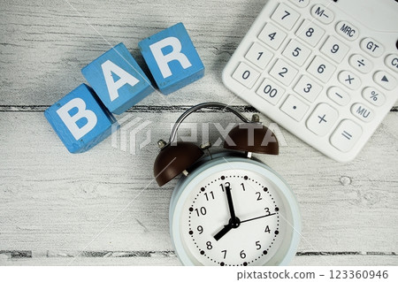 BAR (Best Available Rate) alphabet letters with alarm clock on wooden background BAR (Best Available Rate) alphabet letters with alarm clock on wooden background 123360946