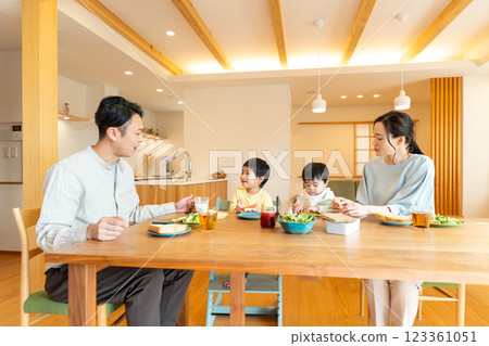 Young family eating at the table 123361051