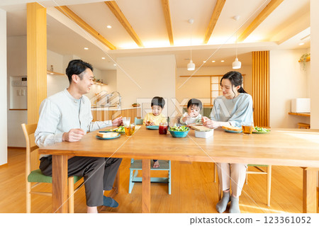 Young family eating at the table 123361052