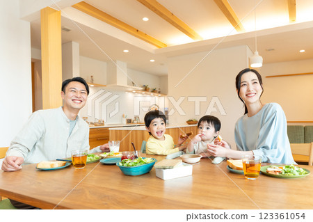 Young family eating at the table Young family eating at the table 123361054