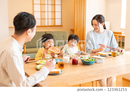 Young family eating at the table 123361253