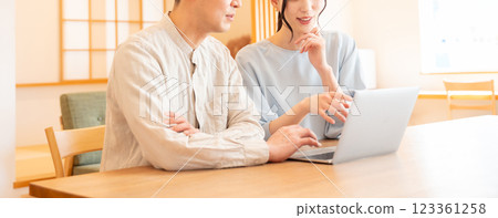 Young couple living room computer 123361258