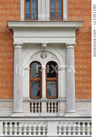 Ancient window on old facade Ancient window on old facade 123361380