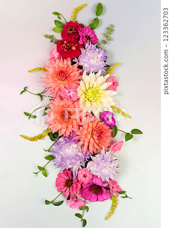 Flowers dahlias, asters, buttercups on a light background, Abstract floral composition, flat lay. Autumn banner for advertising, rustic style, holiday card, selective focus. 123362703