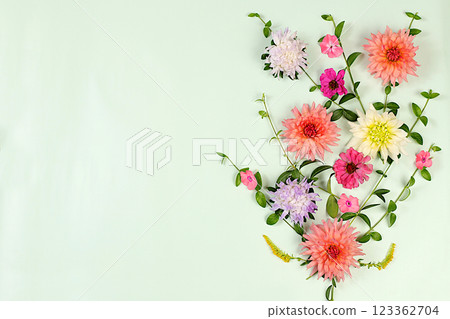 Abstract floral arrangement, Flowers dahlias, asters, buttercups on light background, flat lay. Autumn banner for advertising, rustic style, holiday card, selective focus. 123362704
