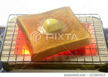 Toasting bread on a charcoal grill 123363017