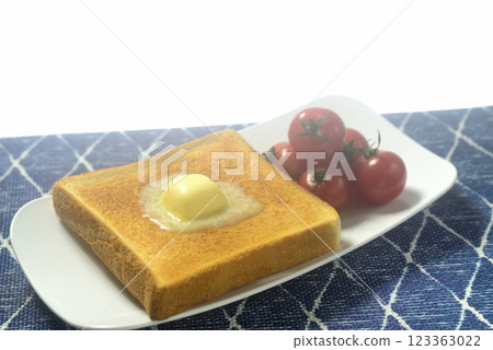 Toasted bread and cherry tomatoes on a plate Toasted bread and cherry tomatoes on a plate 123363022