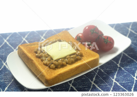 Toasted bread and cherry tomatoes on a plate Toasted bread and cherry tomatoes on a plate 123363026