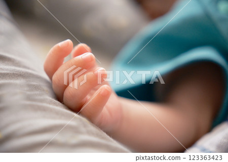 Cute sleeping baby hands 123363423