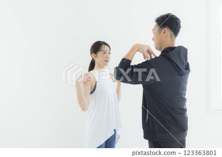 Men and women in sportswear, trainers Men and women in sportswear, trainers 123363801