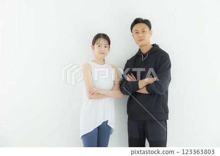 Men and women in sportswear, trainers Men and women in sportswear, trainers 123363803