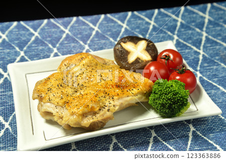 Chicken thigh steak on a plate 123363886